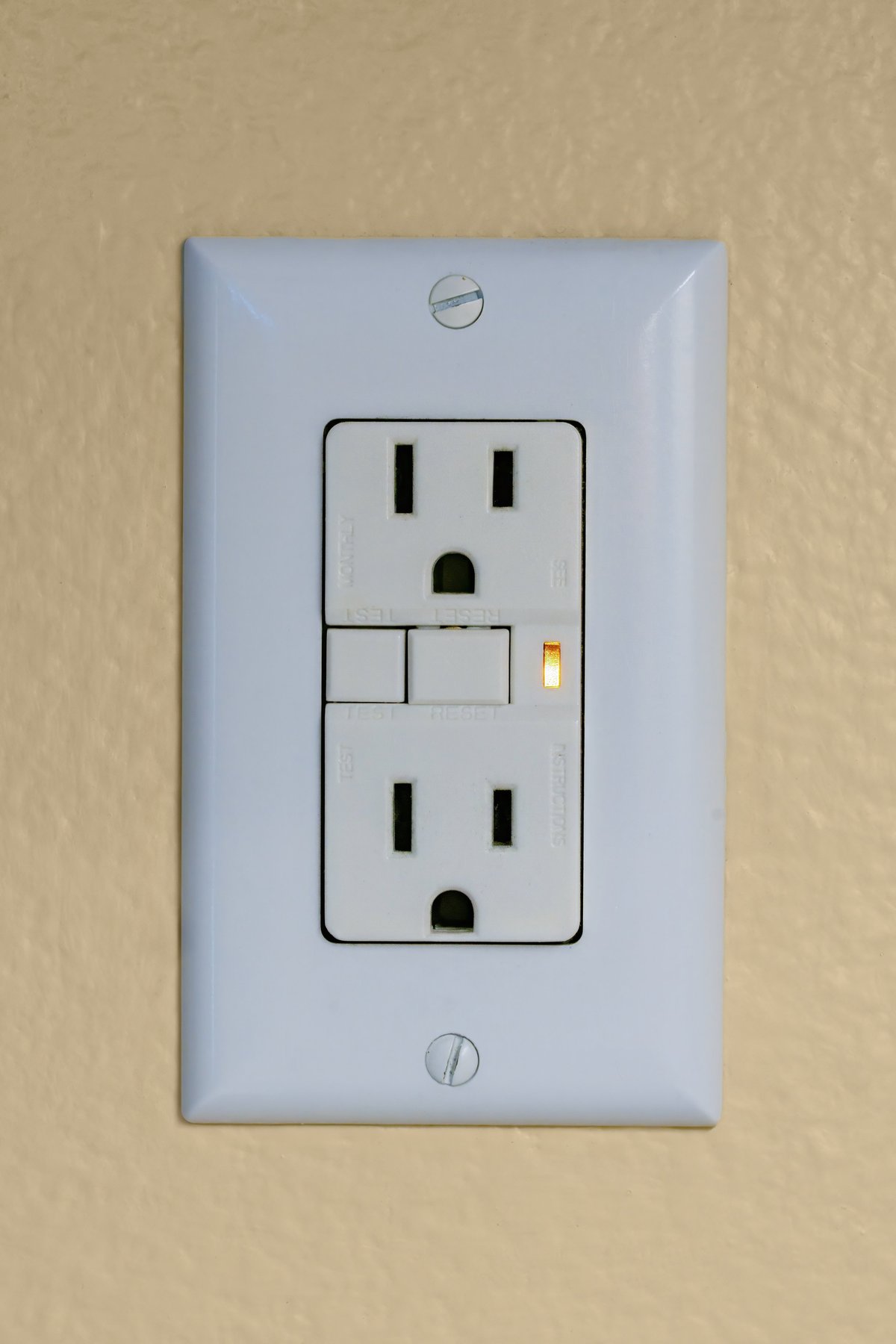 Electrical power socket with tripped ground fault circuit interrupter.
